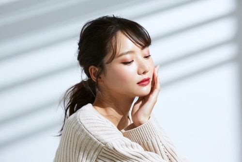 Beauty portrait of young Asian women on light and shadow background