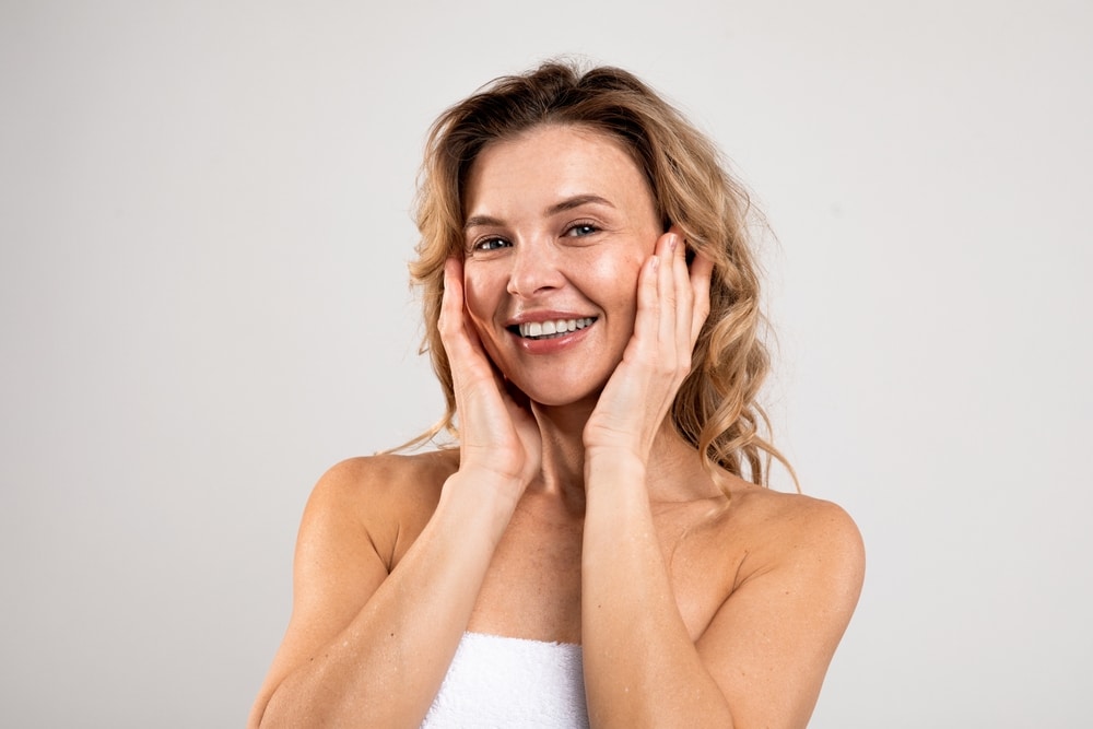 Fresh-faced mature model with glowing skin after vampire face treatment